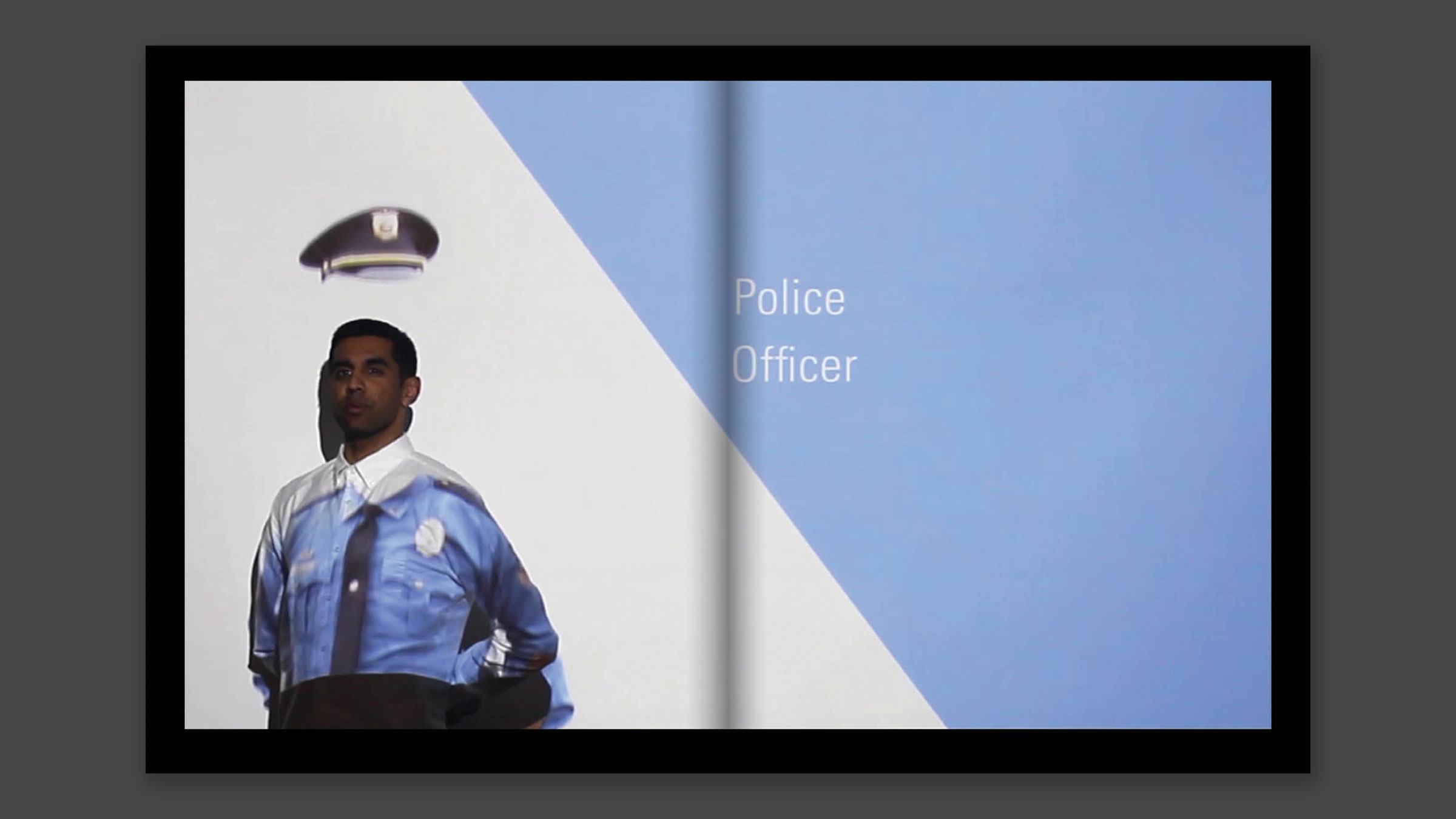 Interior spread the author with a police uniform projected onto him.