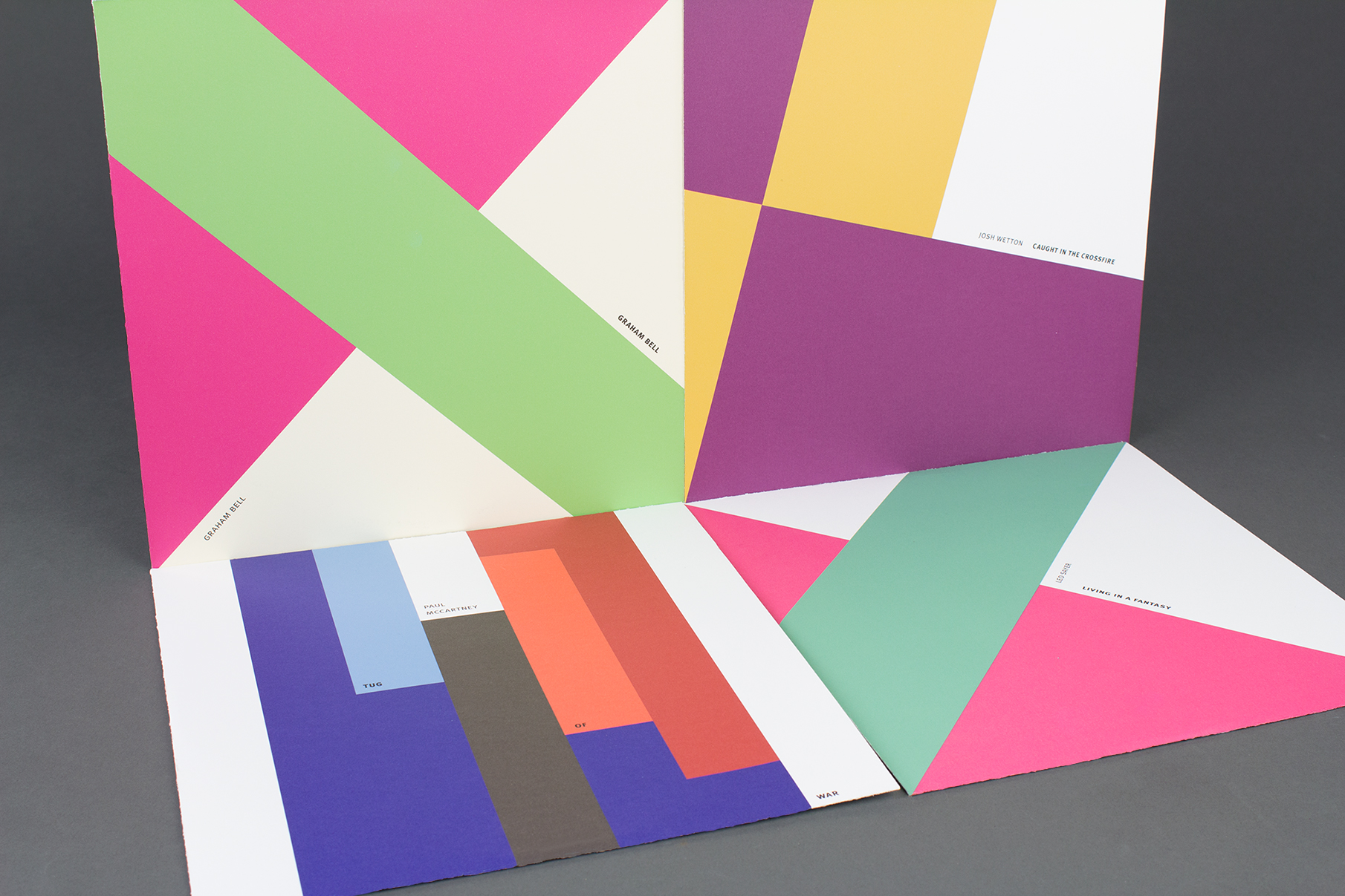 Four vinyl album covers with large color shapes in complementary color schemes.